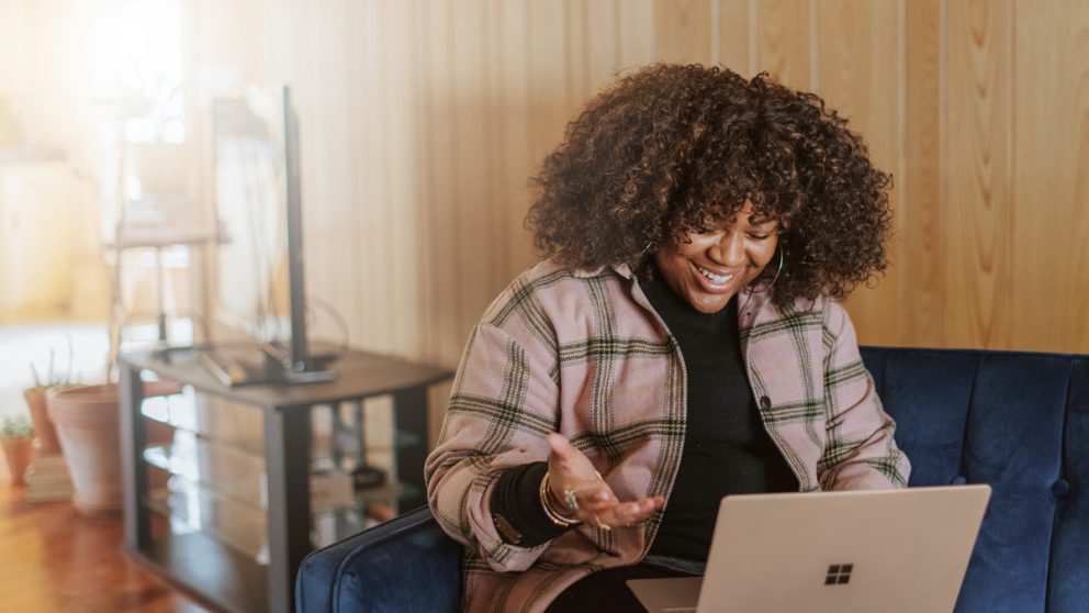 Woman on couch with computer